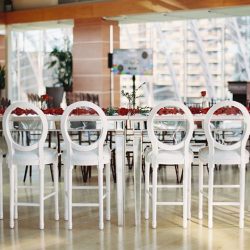 cropped white louis bar stools with mirror community table