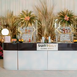 espresso and vanilla bar with marble orb lamps and custom branding