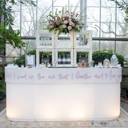 white-martini-bar-with-marble-top-at-the-hort-liita-with-branding-quote-pink